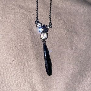 Silver necklace with black and silver gem decal